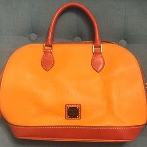 Dooney and Bourke gold with tan trimming